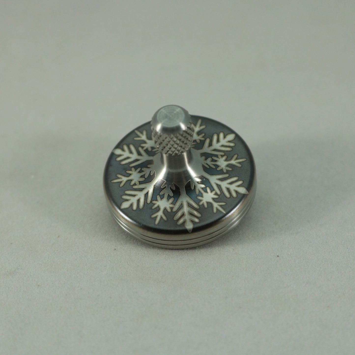 S2- Laser Etched Inverted Snowflake on a Stainless Steel Spinning Top