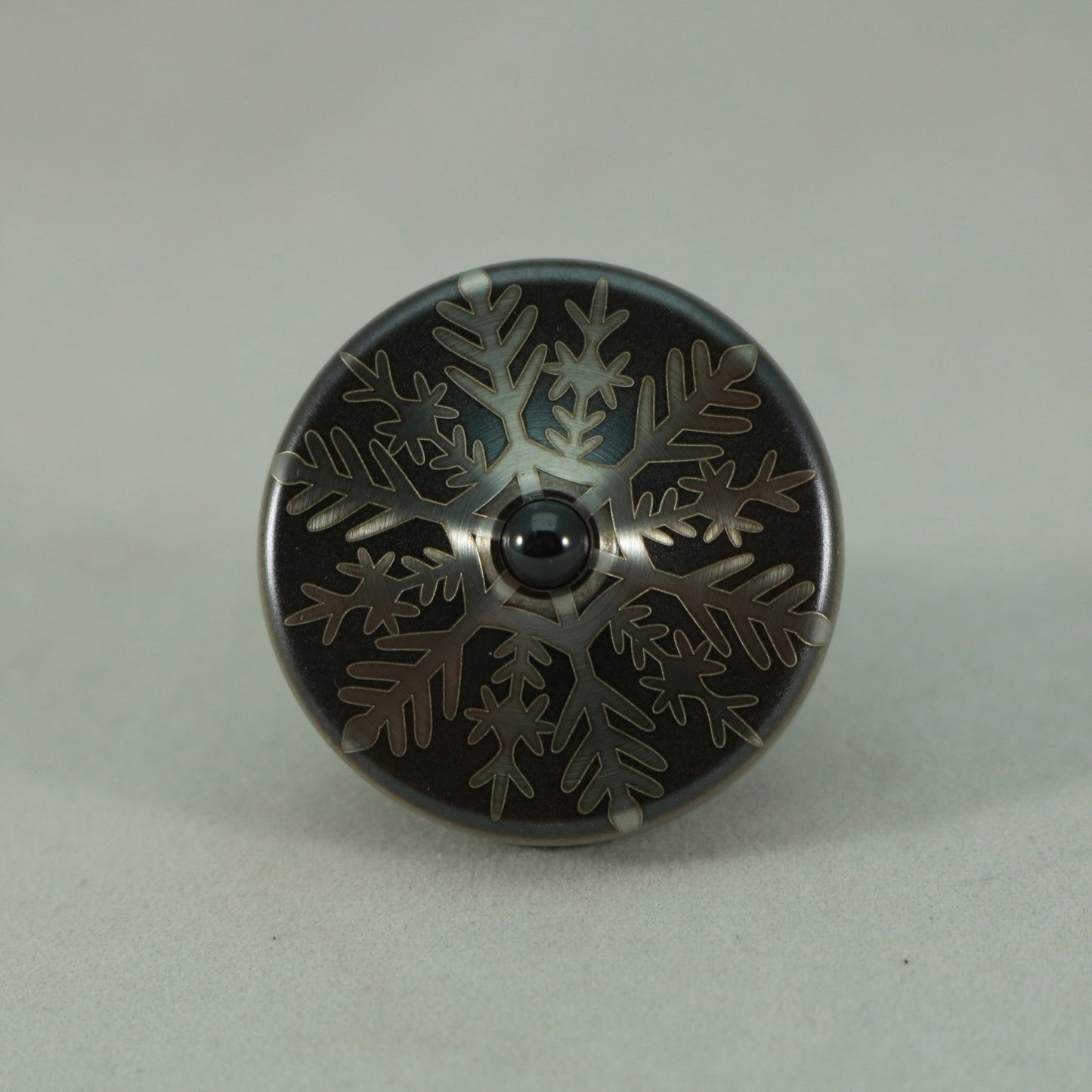 S2- Laser Etched Inverted Snowflake on a Stainless Steel Spinning Top