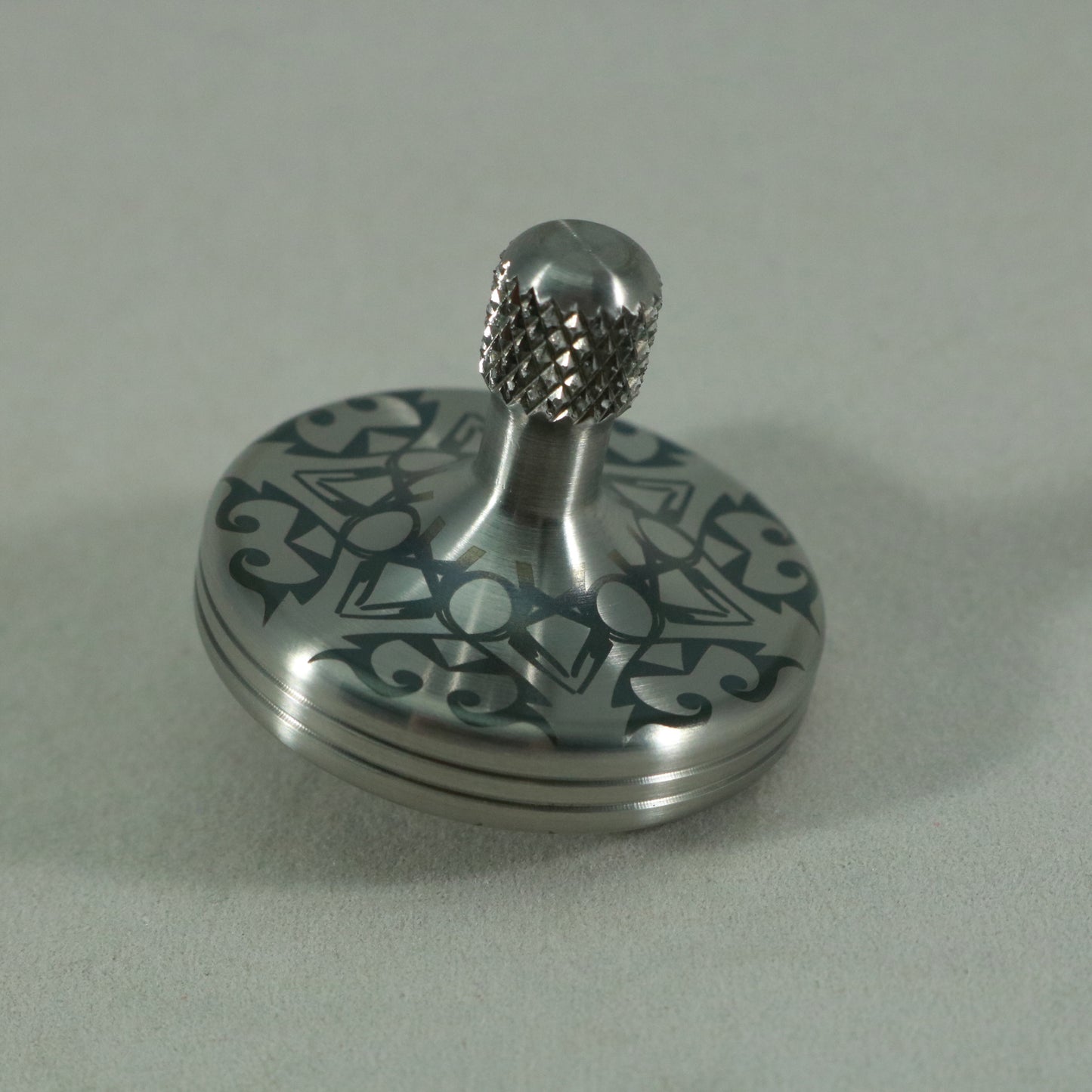 S2- Laser Etched Snowflake on a Stainless Steel Spinning Top v3