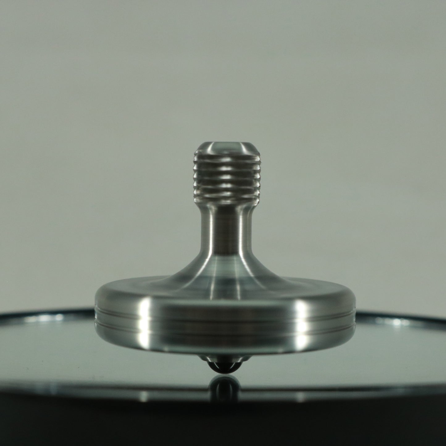 S2- Laser Etched Snowflake on a Stainless Steel Spinning Top v3