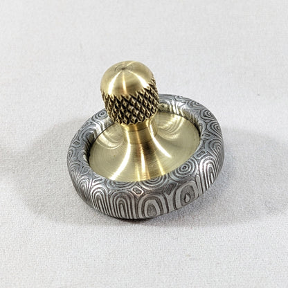 Dynamini - Damasteel and Brass