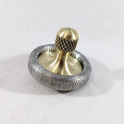 Dynamini - Damasteel and Brass