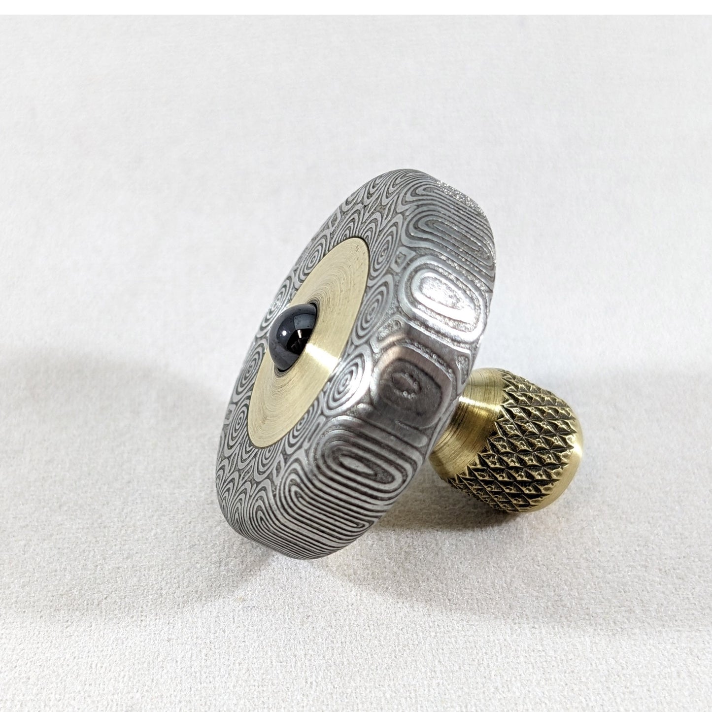 Dynamini - Damasteel and Brass