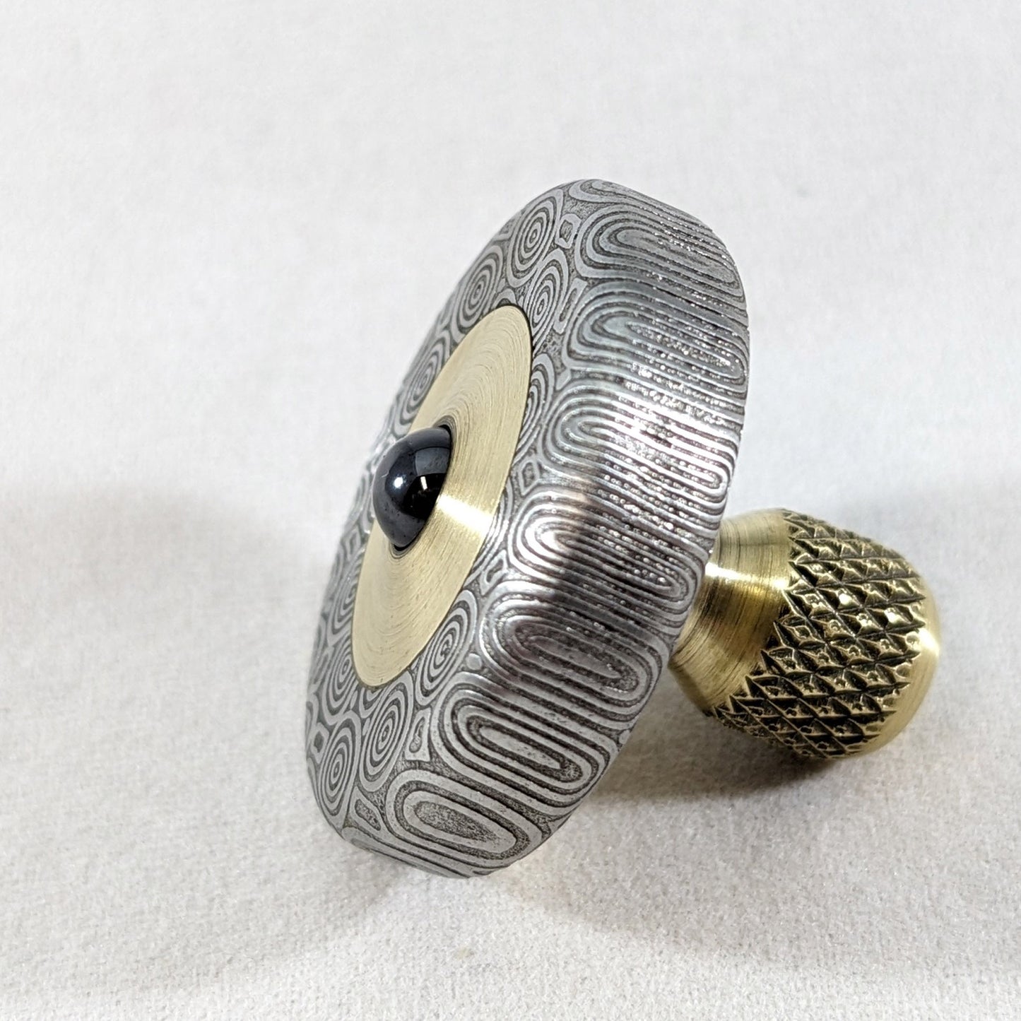 Dynamini - Damasteel and Brass