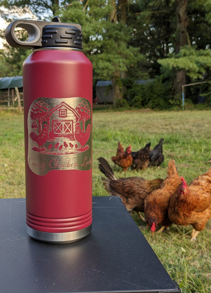 32 oz maroon laser engraved Crazy Chicken Lady water bottle photographed outdoors with chickens in background