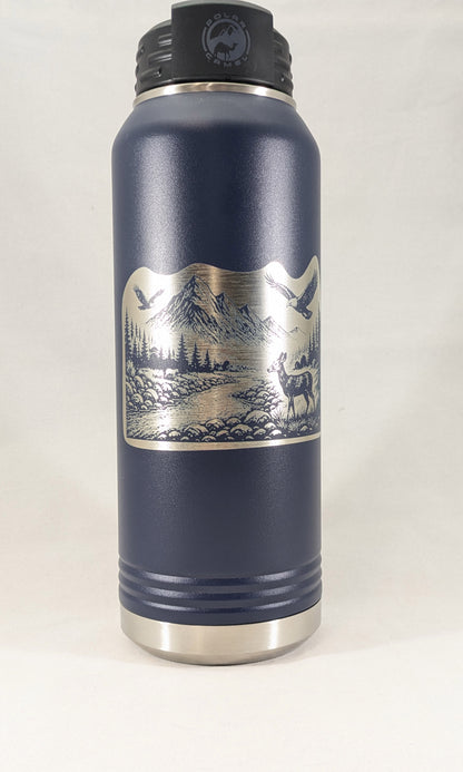 32 oz navy Polar Camel water bottle with laser engraved mountain wildlife scene showing deer, eagles, pine trees, and mountain peaks