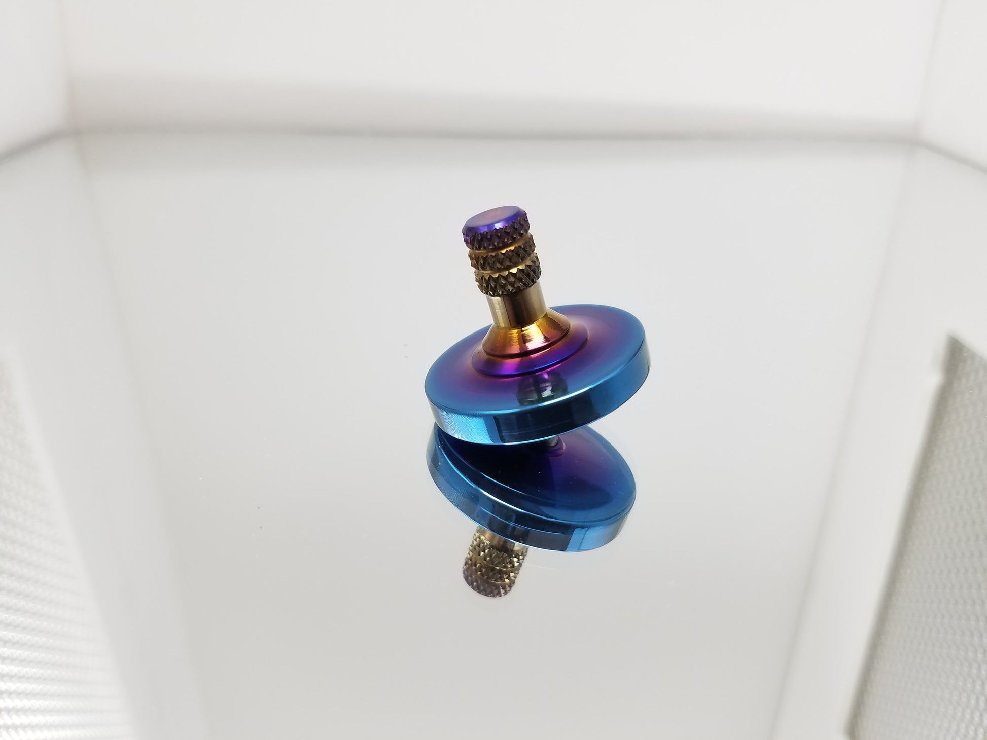 Titanium Spinning Top with a Heat Anodized Finish - Kemner Design