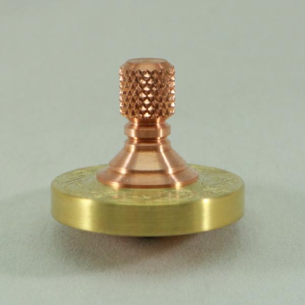 Brass and Copper Two Step spinning top by Kemner Design with engraved ring