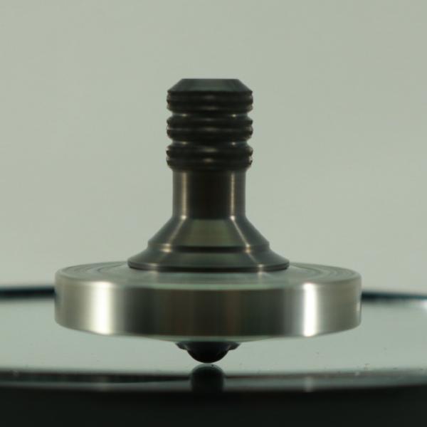 Kemner Design's Engraved Stainless Steel Spinning Top with a Gun Metal Stem
