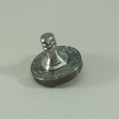 Two Step - Engraved Gunmetal and Brushed Stainless Step Spinning Top - Kemner Design
