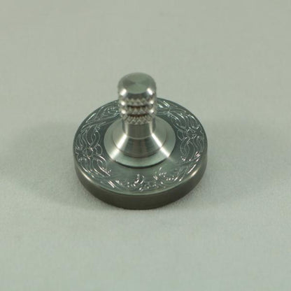 Two Step - Engraved Gunmetal and Brushed Stainless Step Spinning Top - Kemner Design