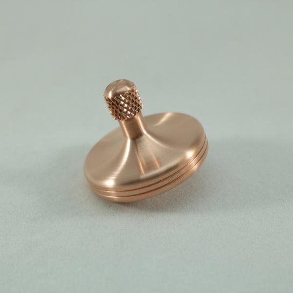S2 precision metal spinning top by Kemner Design shown here in brushed copper