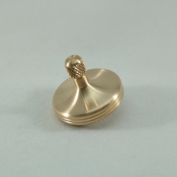 Kemner Design's S2 metal spinning top in brushed phosphor bronze