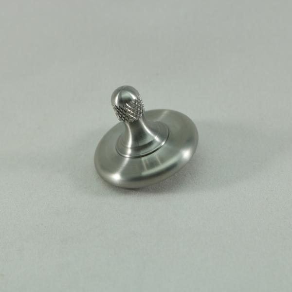 M3 precision spinning top shown here in stainless steel over stainless steel