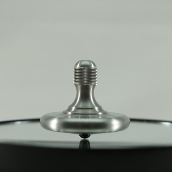 Spinning view of the M3 metal spinning top by Kemner Design shown here in stainless steel