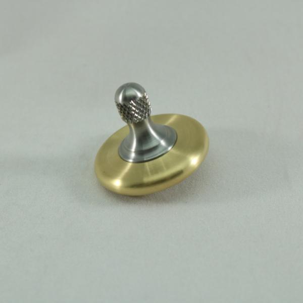 M3 spinning top in brushed brass and stainless steel