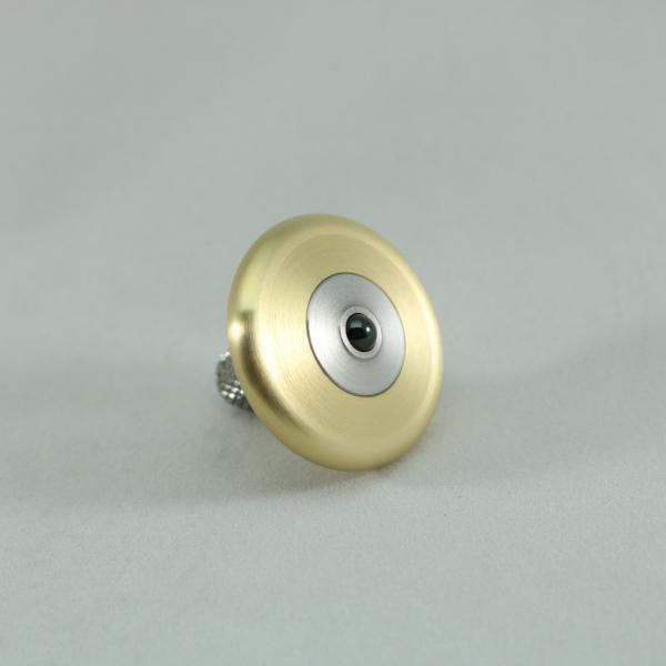 M3 precision metal spinning top shown here in brushed brass and stainless steel featuring a precision ceramic bearing
