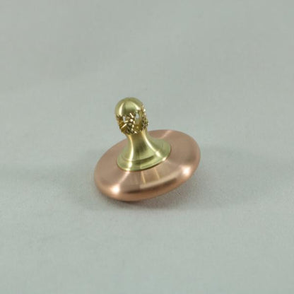 M3 brushed copper and brass spinning top by Kemner Design