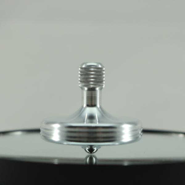 Caught mid spin is the S2 in brushed aluminum spinning top by Kemner Design