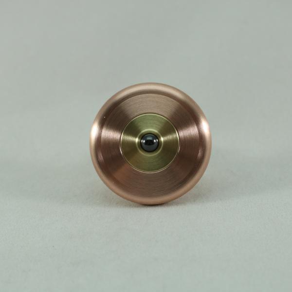 Bottom view of the M3 by Kemner Design featured here in copper and brass with a ceramic bearing