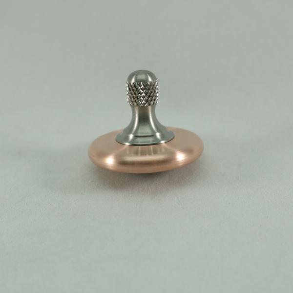 M3 copper and titanium spinning top with a knurled stem