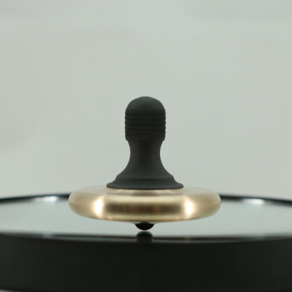 Kemner Design's M3 in brushed bronze and blacked out stainless steel caught in a spin