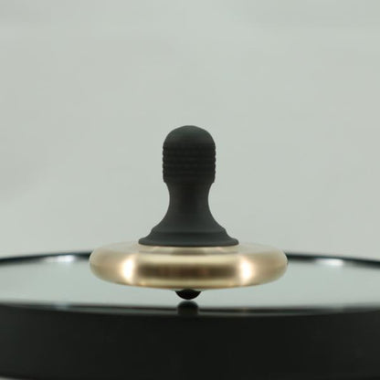 Kemner Design's M3 in brushed bronze and blacked out stainless steel caught in a spin