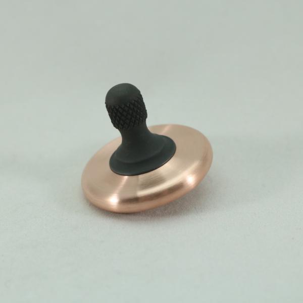 Beautiful brushed copper and blacked out stainless steel M3 spinning top by Kemner Design