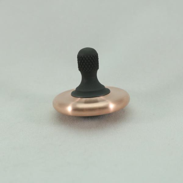 Gently rounded curves await you with this brushed copper and blacked out stainless steel M3 spinning top by Kemner Design