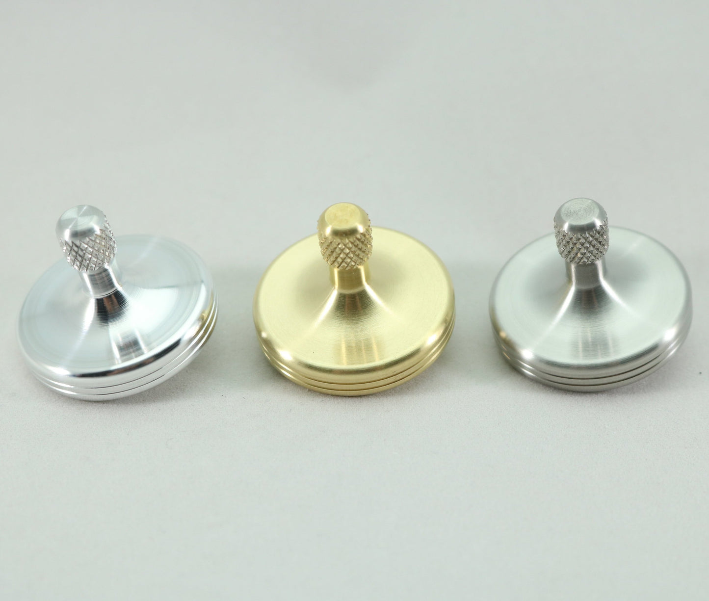 The S2 basic metals collection shown from left to right in aluminum, brass and stainless steel