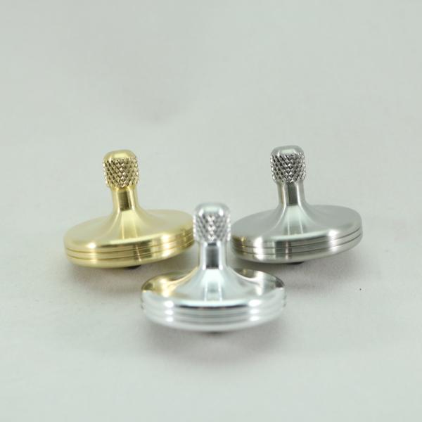The S2 basic metals collection includes one each of the brushed aluminum, brass and stainless steel S2 spinning top