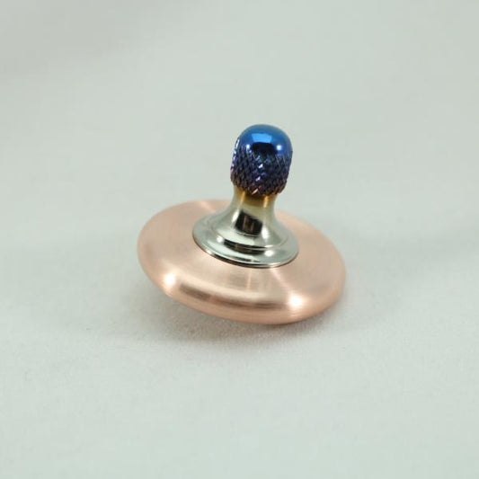 Brushed Copper and flamed titanium M3 metal spinning top by Kemner Design