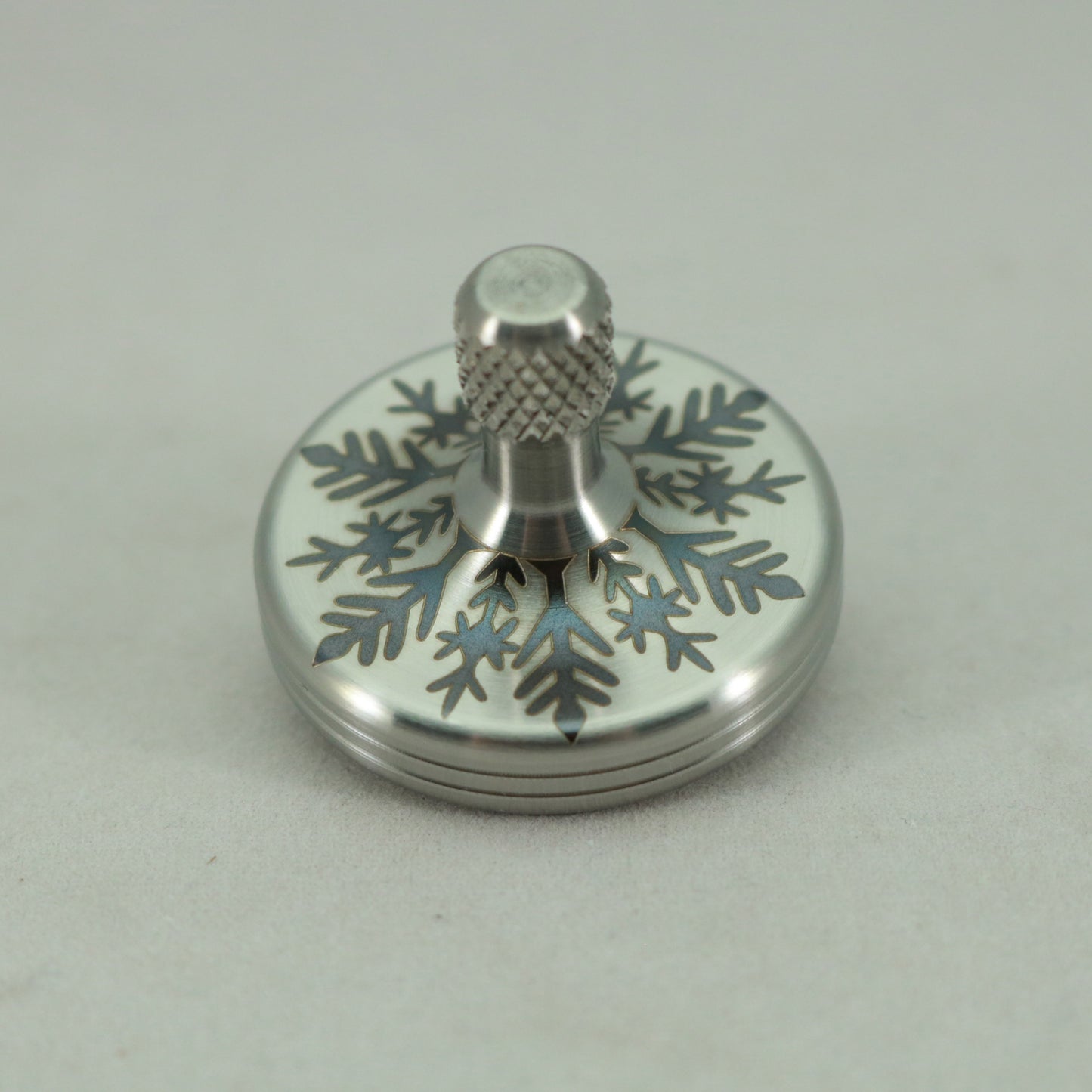 S2- Laser Etched Snowflake on a Stainless Steel Spinning Top