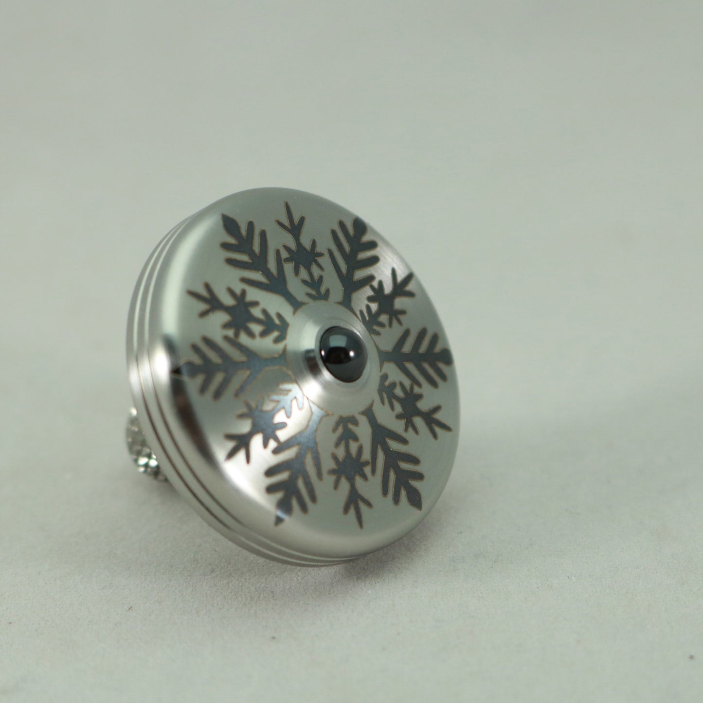S2- Laser Etched Snowflake on a Stainless Steel Spinning Top