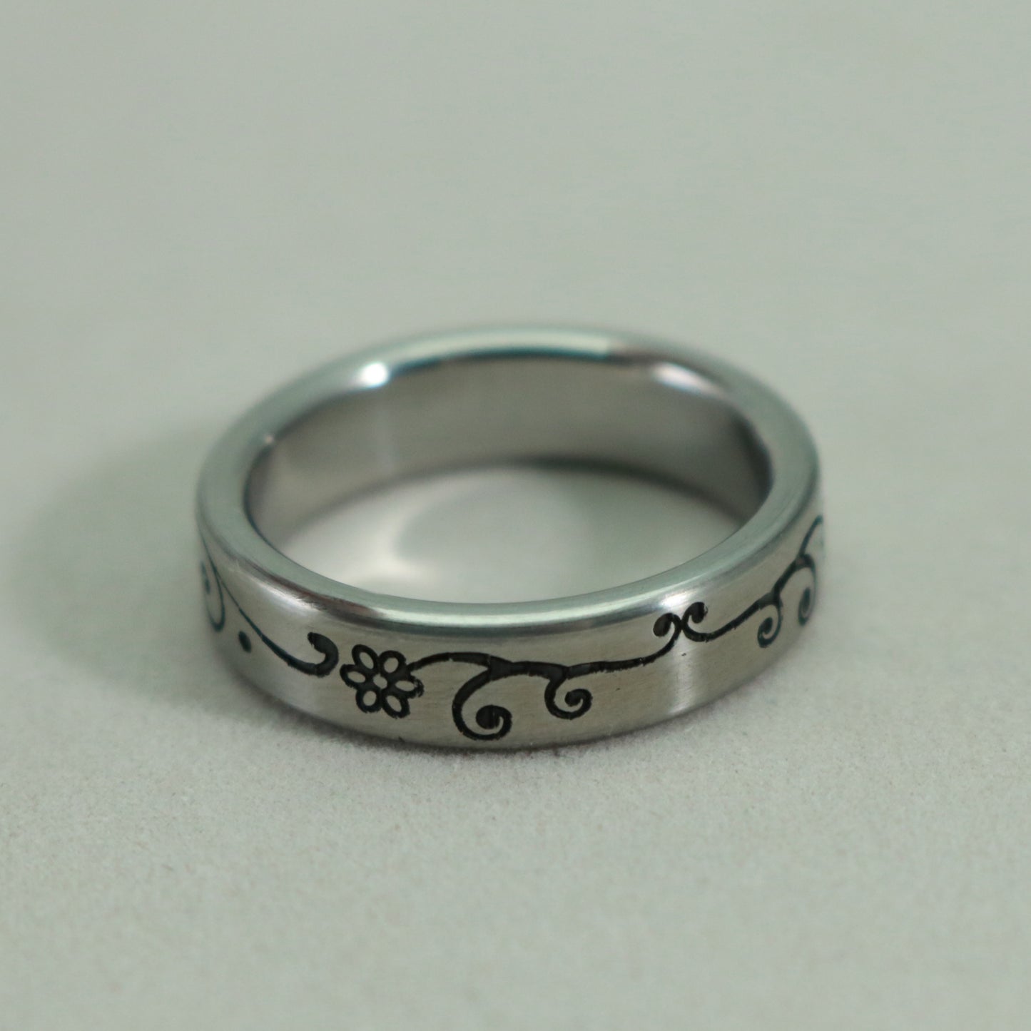 Floral engraved pattern on a size 7 1/4 stainless steel ring