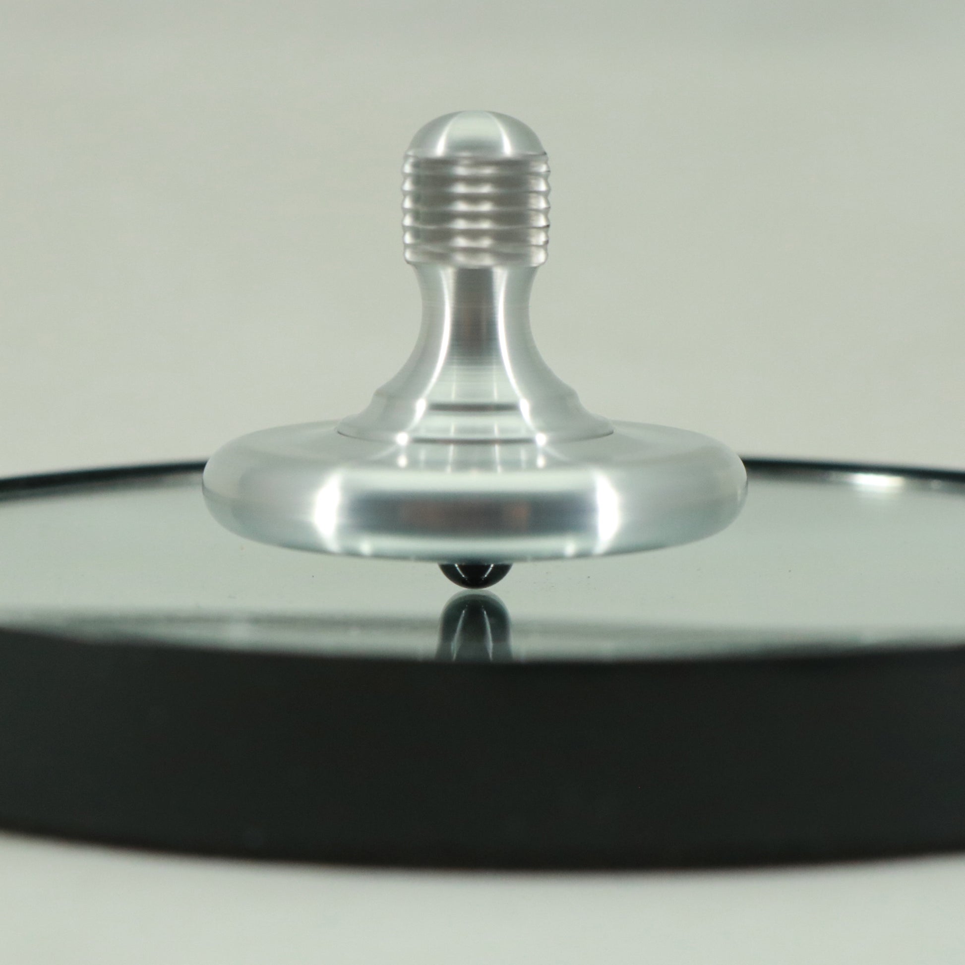The M3 precision metal spinning top by Kemner Design shown here in brushed aluminum
