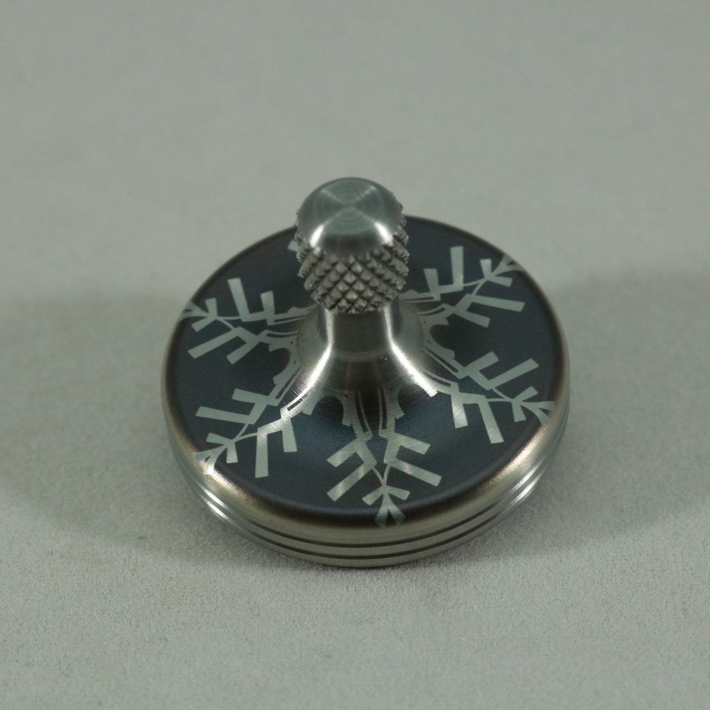 S2- Laser Etched  Inverted Snowflake on a Stainless Steel Spinning Top V2