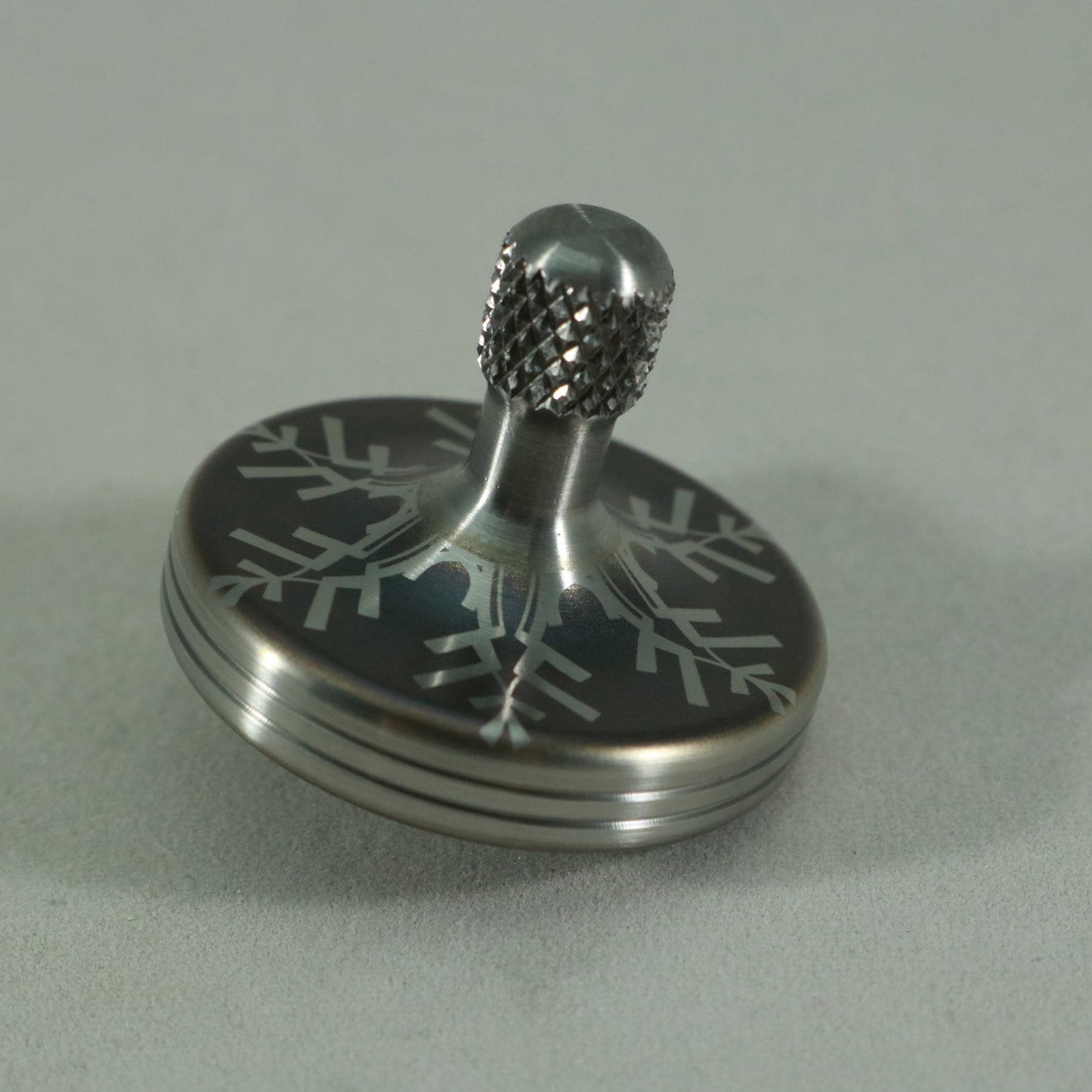 S2- Laser Etched  Inverted Snowflake on a Stainless Steel Spinning Top V2