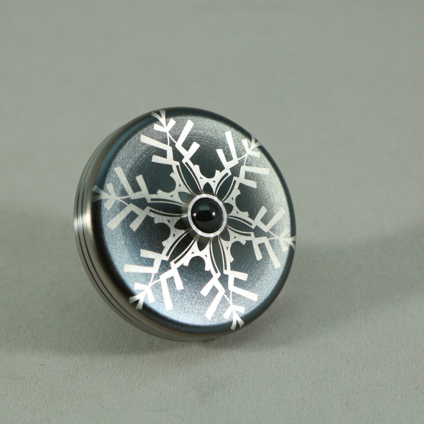 S2- Laser Etched  Inverted Snowflake on a Stainless Steel Spinning Top V2
