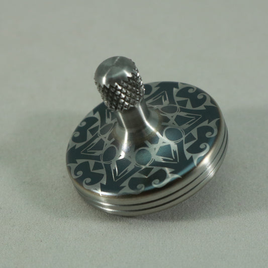 S2- Laser Etched  Inverted Snowflake on a Stainless Steel Spinning Top Version 3
