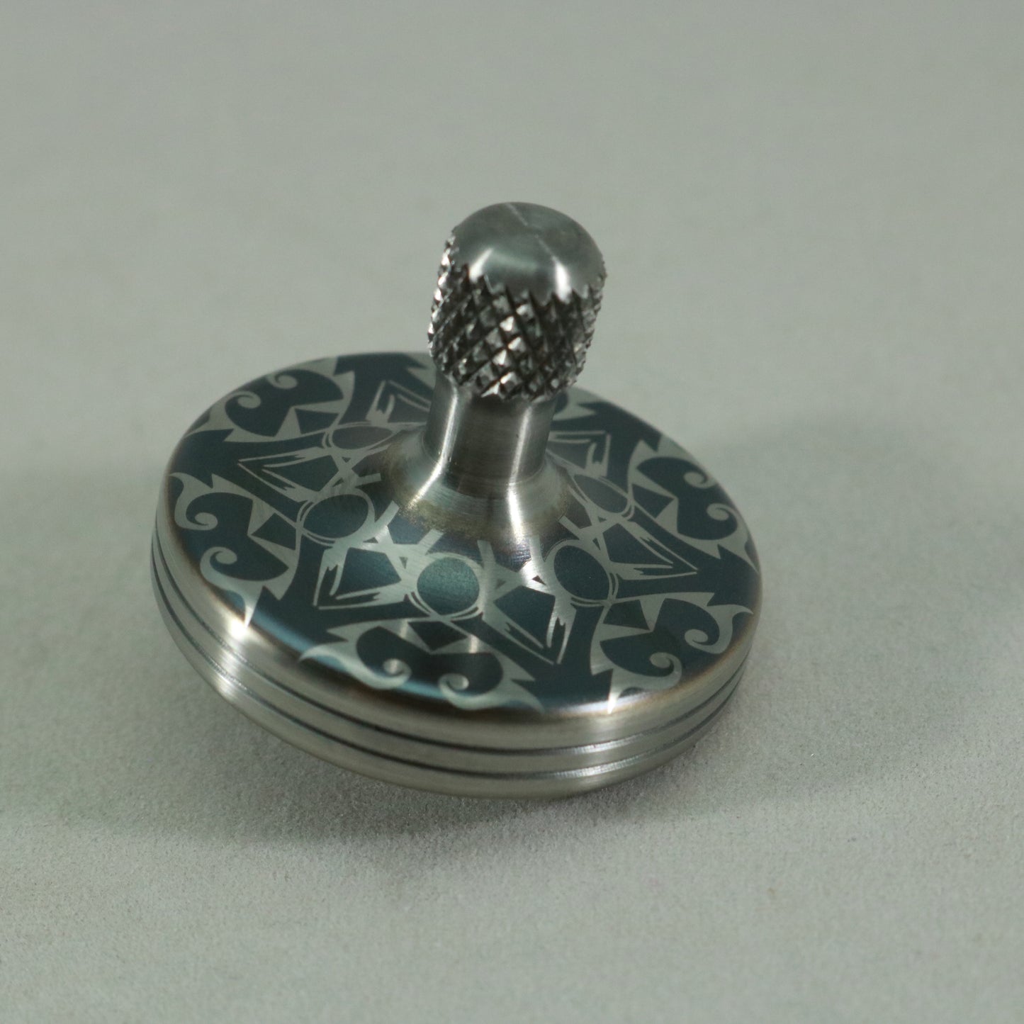S2- Laser Etched  Inverted Snowflake on a Stainless Steel Spinning Top Version 3