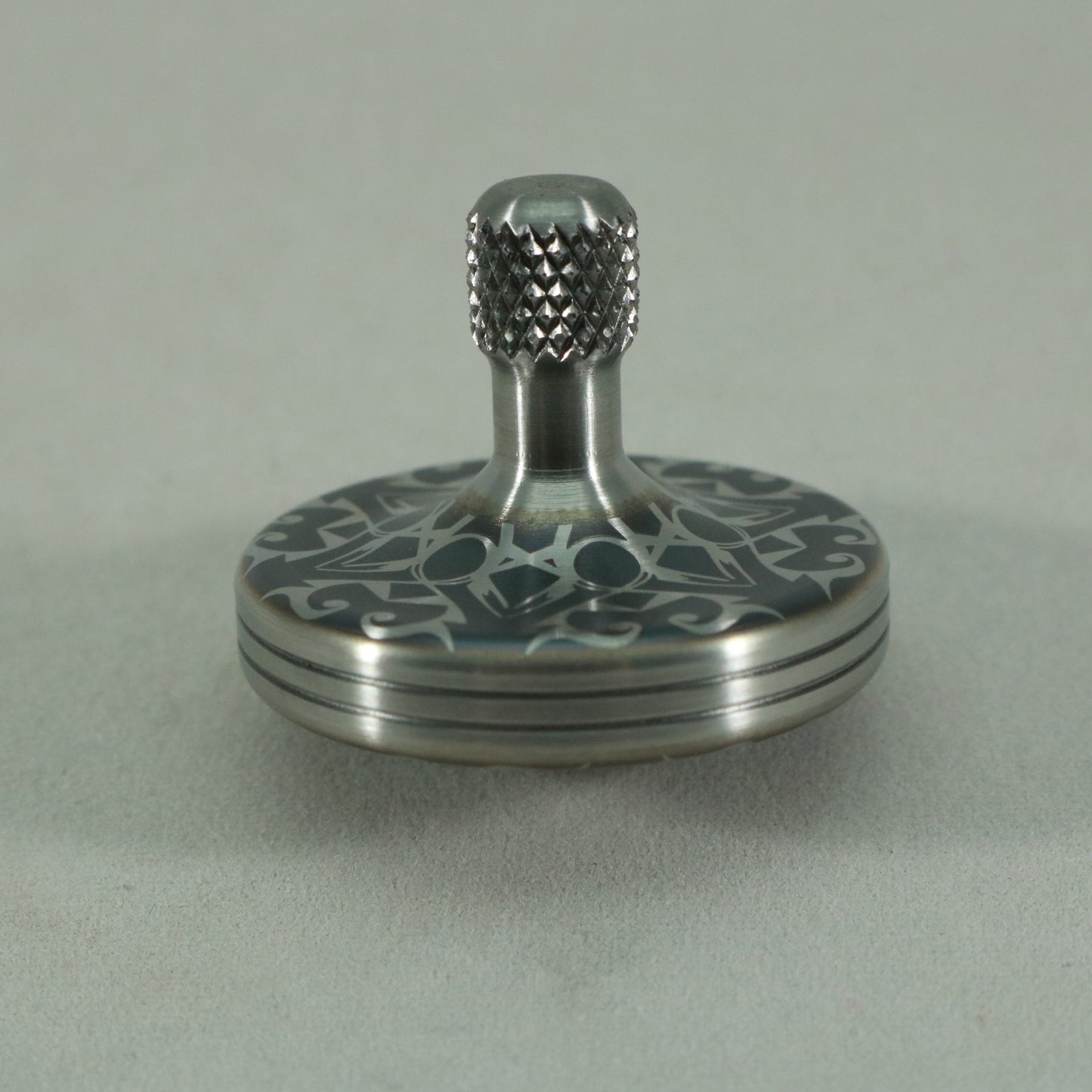 S2- Laser Etched  Inverted Snowflake on a Stainless Steel Spinning Top Version 3