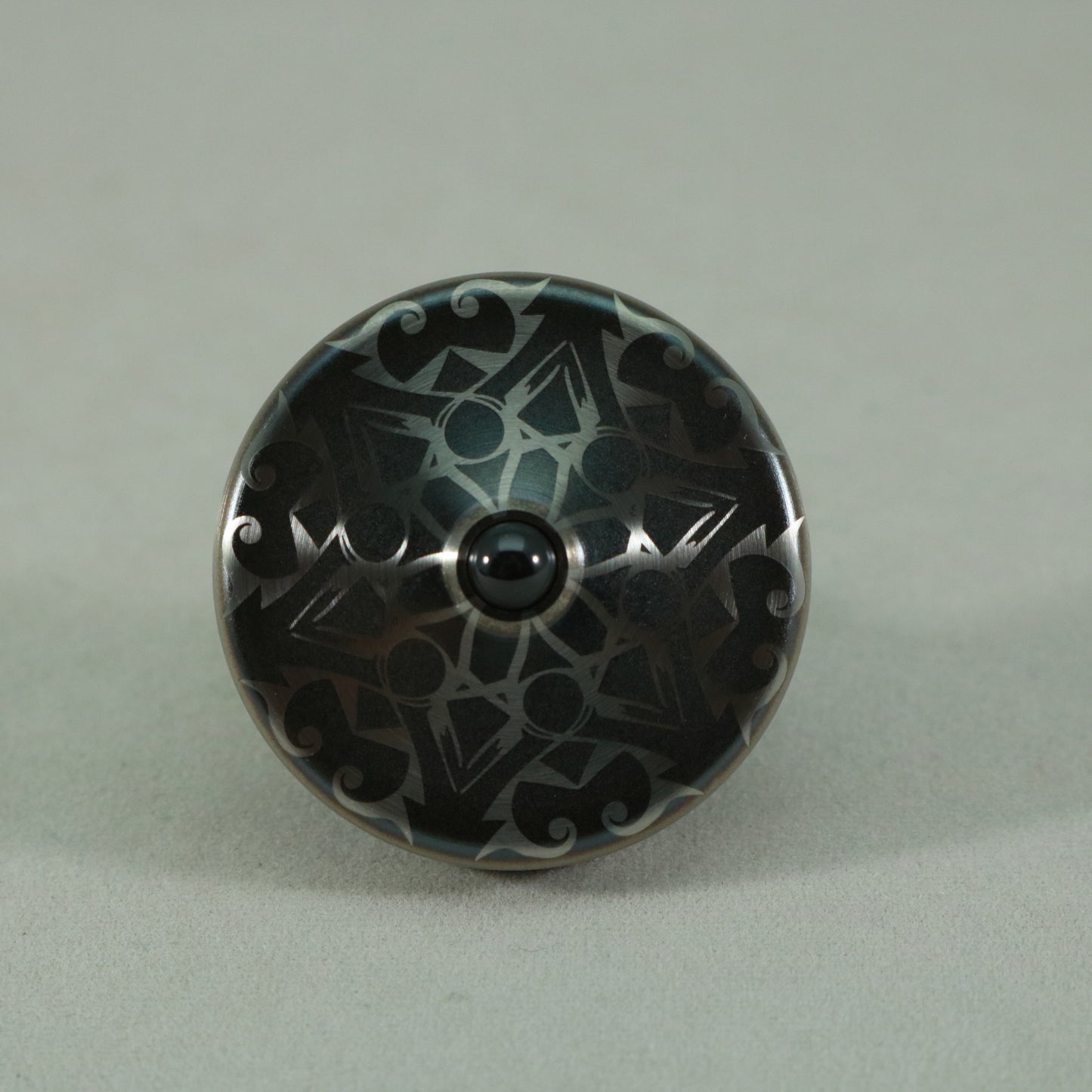 S2- Laser Etched  Inverted Snowflake on a Stainless Steel Spinning Top Version 3