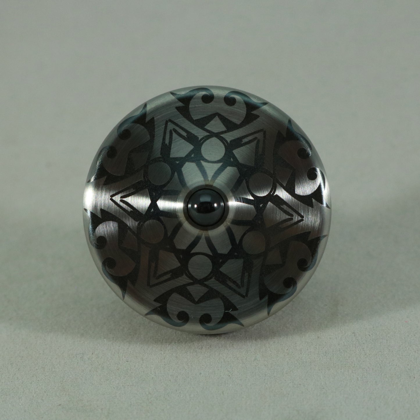 S2- Laser Etched Snowflake on a Stainless Steel Spinning Top v3